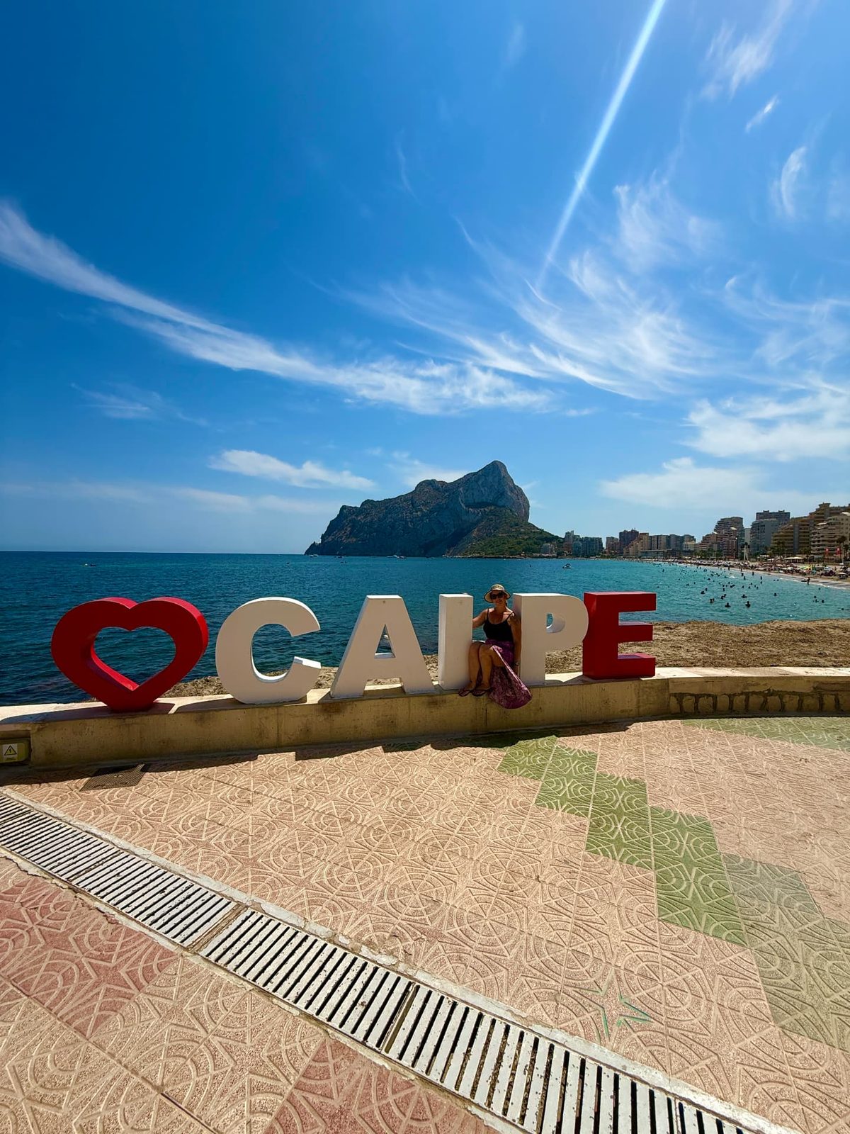 The I love Calpe letters on the seafront with the Peñón de Ifach behind