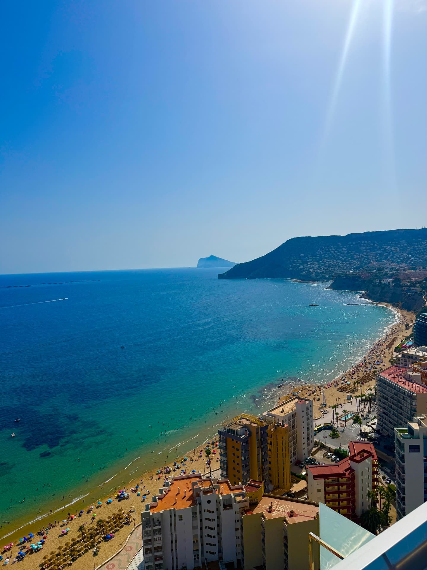 Looking down over Playa del Arenal-Bol in Calpe with the headland and turquoise sea beyond