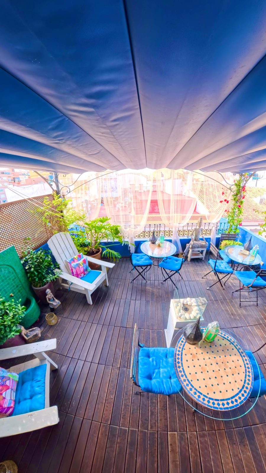 The shaded rooftop terrace with mosaic tables at Terra de Mar Boutique in Calpe